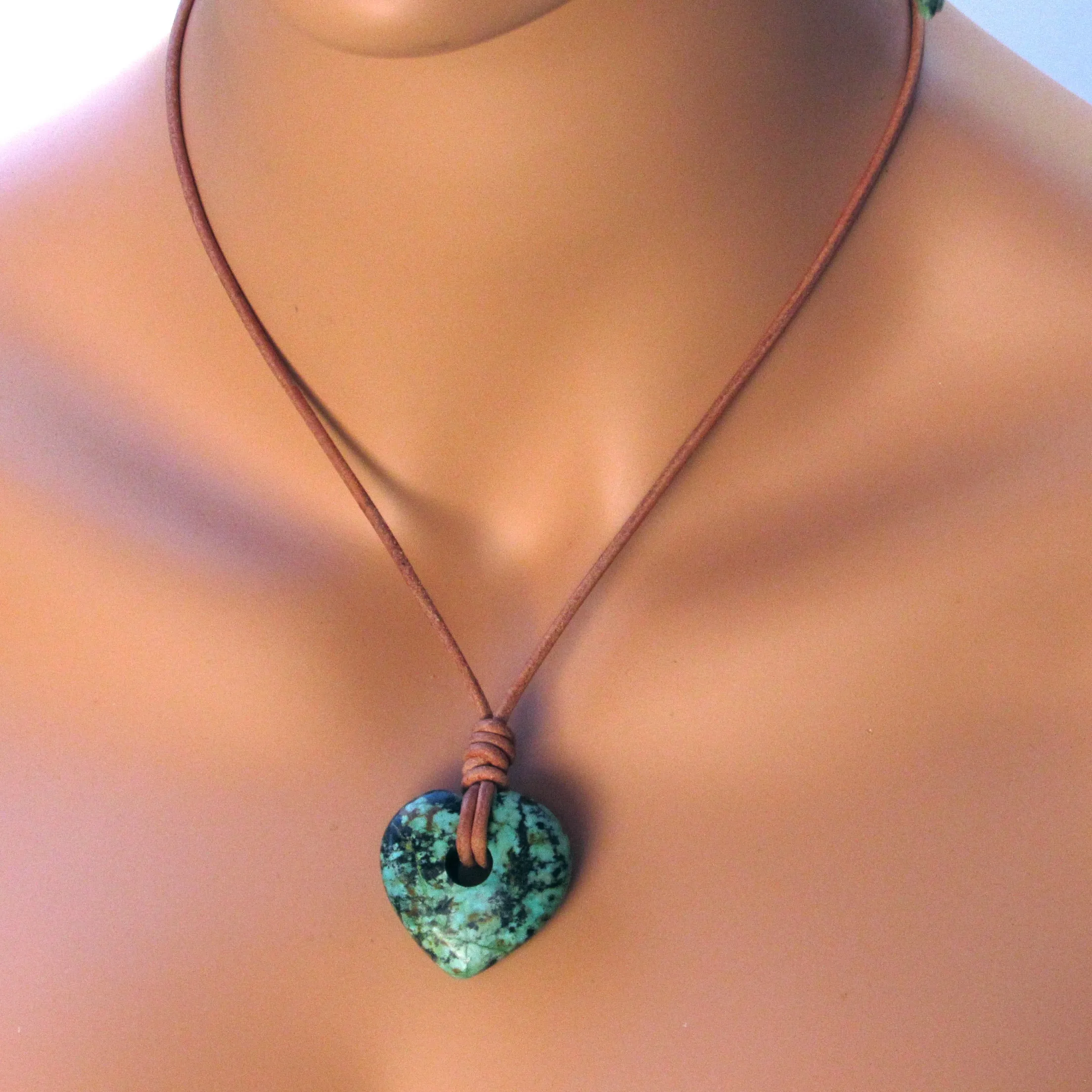 African Turquoise gemstone heart on natural leather with copper clasp